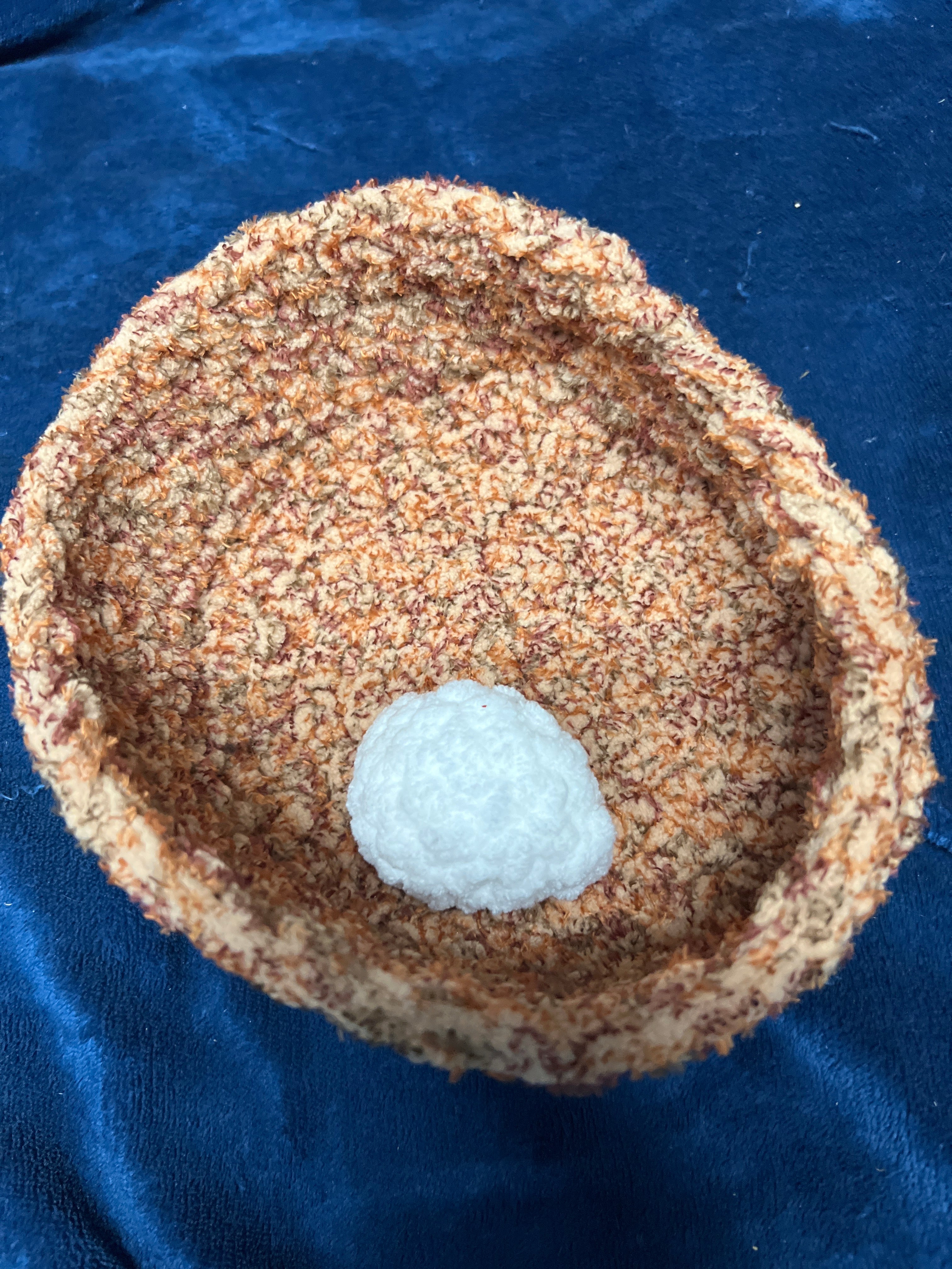 Crocheted chicken in nest