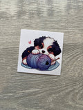 Puppy with Yarn on a Rug Sticker